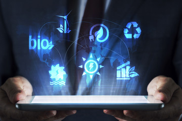 Renewable energy sources concept on tablet with hologram