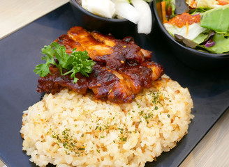 Fried rice with roasted honey and sesame glazed chicken served with salad.