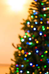 Colorful Christmas tree lights bokeh - A bright multicolor bokeh created by a set of de-focused lights on a Christmas tree.