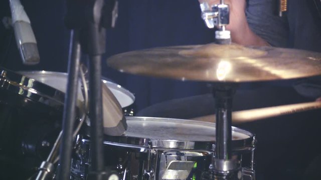 drummer plays his drum set