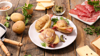 baked potato with ham and raclette cheese