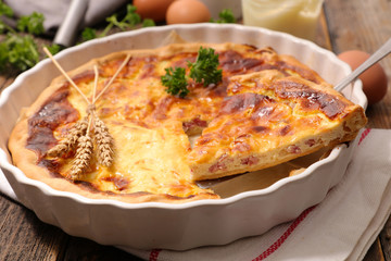 homemade quiche on wood background