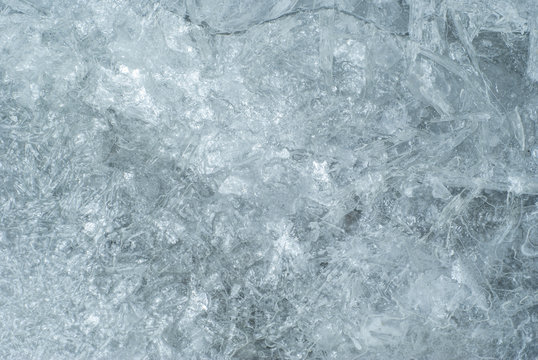 texture, background: cold shiny ice surface with cracks, patterns and bubbles, consisting of ice crystals