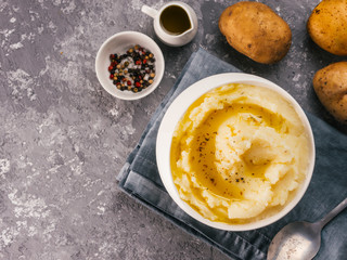 Mashed potatoes on gray concrete background