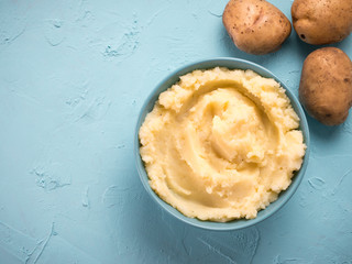 Mashed potatoes on blue concrete background