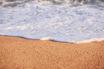 Fototapeta na wymiar The Balearic sea in Spain. Soft Wave Of Blue Ocean On Sandy Beach. Background. Selective focus.Summer outdoor nature harmony. Summer holiday serenity.