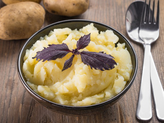 Mashed potatoes on wooden background
