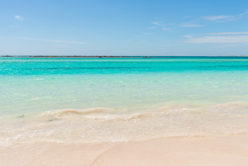Beautiful shoreline with white sand and turquoise water in the Caribbean Sea. La Tortuga (Turtle) island, Venezuela.