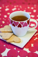 Heart cup of tea with heart-shaped cookies for Valentine's day