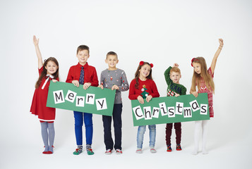 Fototapeta premium Cheerful children holding christmas decoration