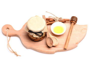 Nuts with wooden spoons and tied cinnamon sticks