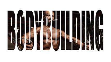 Handsome man with big muscles working out in gym. Muscular bodybuilder doing exercises. Motivation sign.