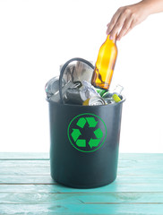 Recyclable garbage consisting of glass, plastic bottle, metal and paper in recycle bin, Ecology and recycle concept.