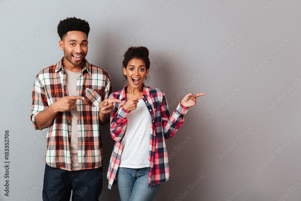 Sticker Portrait of a happy young african couple standing together