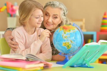 grandmother and granddaughter doing homework