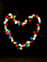 Bokeh with the shape of a heart with multi colors