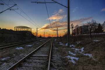 Fototapeta na wymiar Industrial landscape with railroad and beauty colorful sky