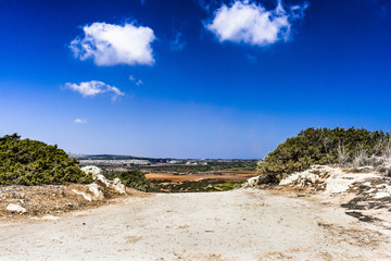Dusty road at the Cape Greco