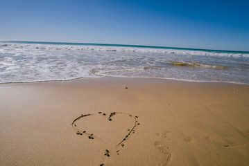 Heart in the sand on a beach in Portugal