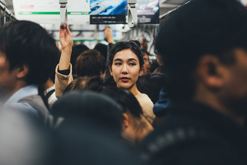 Beautiful japanese woman in the metro station - obrazy, fototapety, plakaty