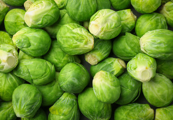 Raw Brussels sprouts as background - obrazy, fototapety, plakaty