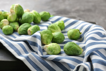 Fresh raw Brussels sprouts on striped cloth