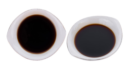 Bowl with soy sauce isolated on white background