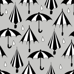 cartoon black and white umbrella seamless pattern on a gray background