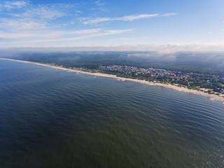 Aerial view over Klaipeda pier entrance to the Baltic sea in Lithuania, during summer time.	