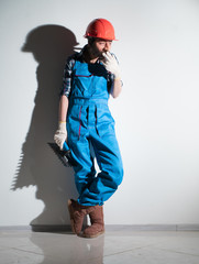 Worker with a spatula smokes a cigarette