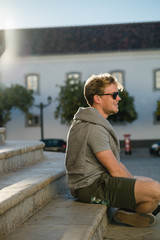 Man in front of ancient building in Portugal