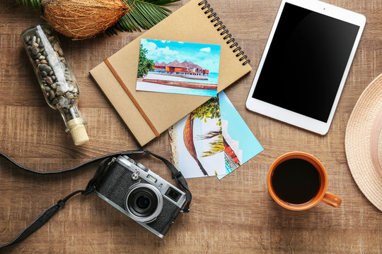 Composition with travel souvenirs on wooden background