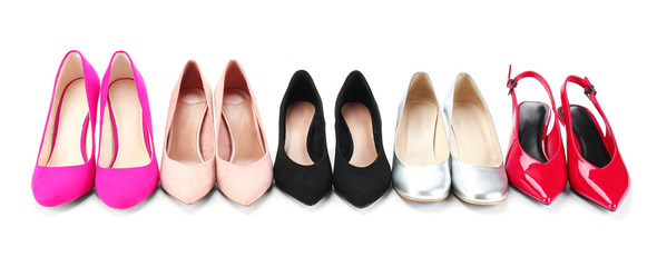 Different female shoes on white background