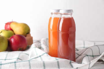 Bottles of fresh juices on table