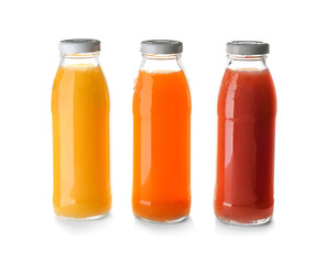 Bottles with juices on white background