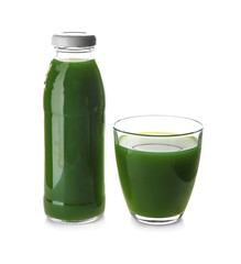 Bottle and glass with juice on white background