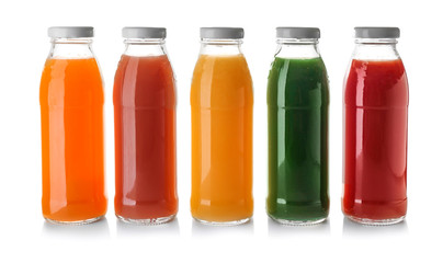 Bottles with juices on white background