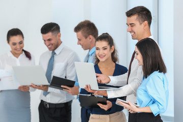 Team of young consulting experts on business meeting in office