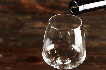 wine is poured into an empty glass