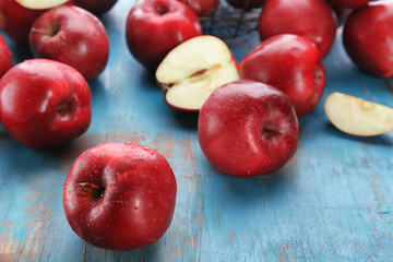 Delicious red apples on table