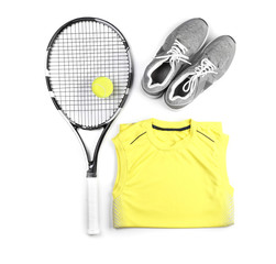 Tennis racket, ball, clothes and shoes on white background