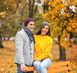 Fototapeta premium Young couple in park on autumn day