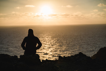 Fototapeta premium Man on the cliffs in Portugal