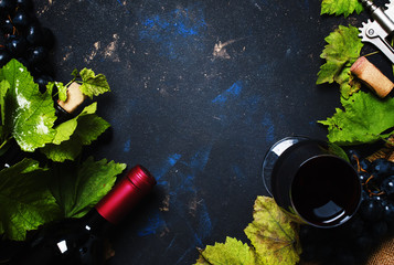 Red wine with grape, black background, top view