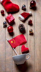 White cup and China flag with Christmas decoration