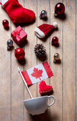 White cup and Canada flag with Christmas decoration