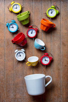 Color cups with alarm clocks