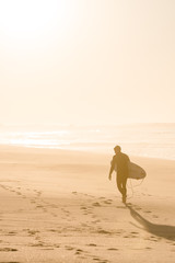 Surfer on the beach in Portugal