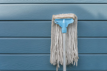 Floor cleaning equipment set on a blue background.