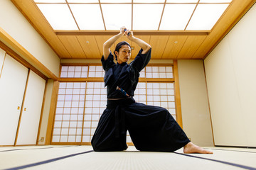 Samurai training in a traditional dojo, in Tokyo